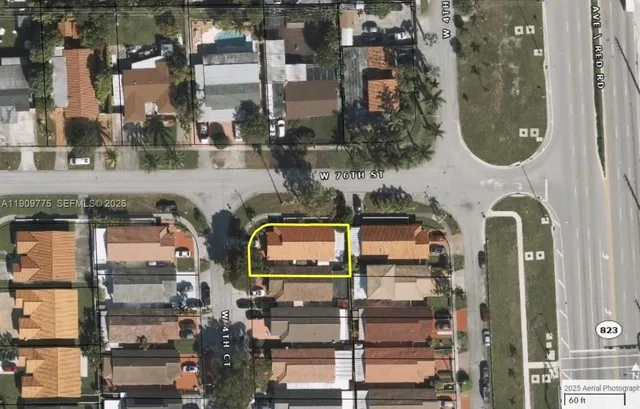 an aerial view of a residential apartment building with a yard