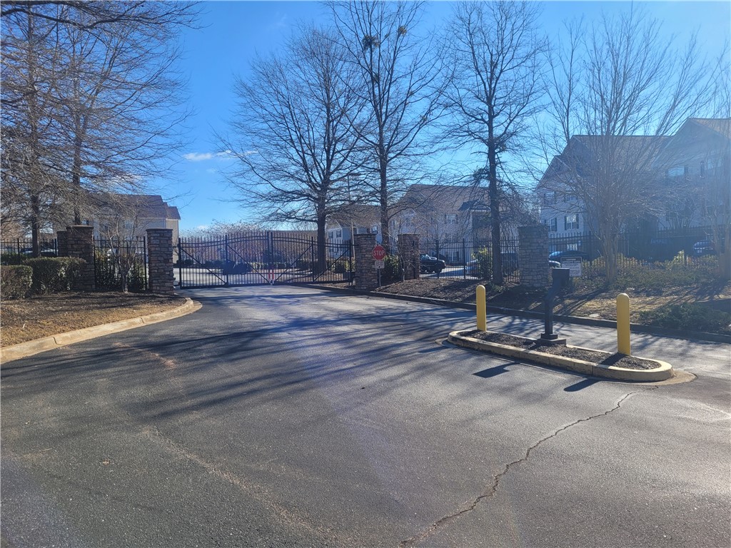 302 Lookover Drive Anderson, SC 29621 - Photo 13 of 23 This community entrance provides secure access with its robust gate and stately stone pillars.