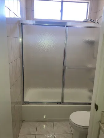 a kitchen with stainless steel appliances a refrigerator and a stove