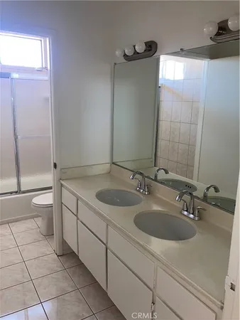 a bathroom with a sink and toilet