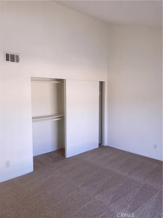 a view of an empty room with a fireplace