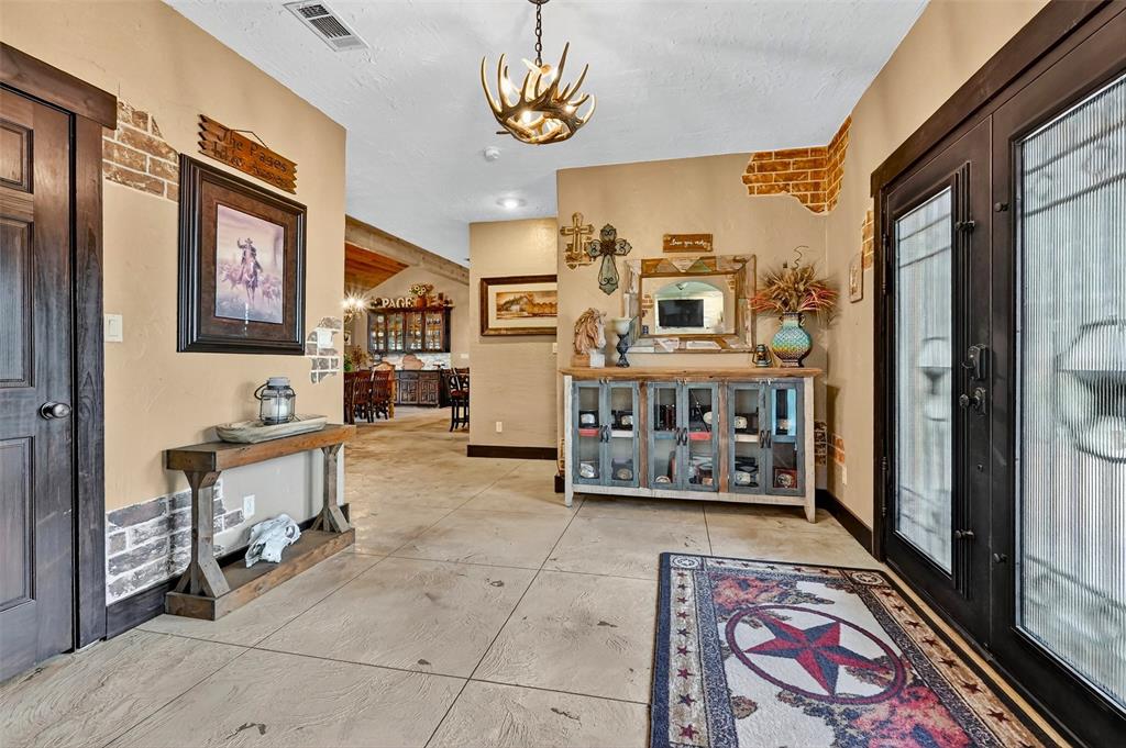 1717 Batey Road Collinsville, TX 76233 - Photo 11 of 40 a living room with furniture and a rug