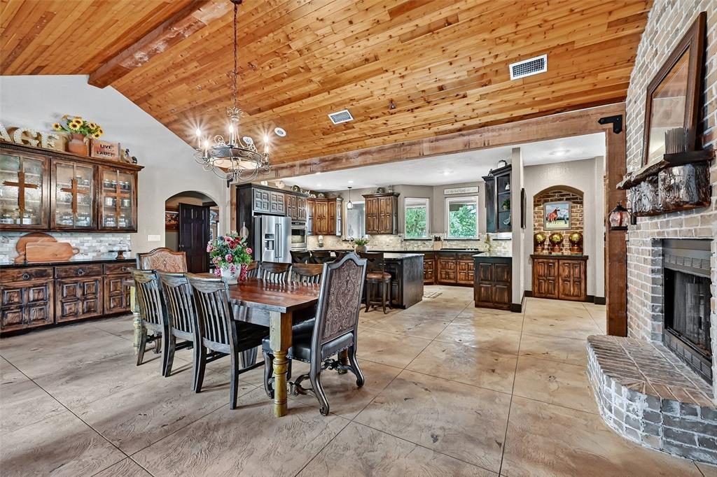 1717 Batey Road Collinsville, TX 76233 - Photo 12 of 40 a view of a dining room with furniture window and wooden floor