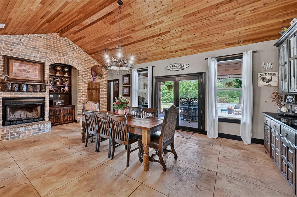 1717 Batey Road Collinsville, TX 76233 - Photo 13 of 40 a view of a dining room with furniture window and outside view