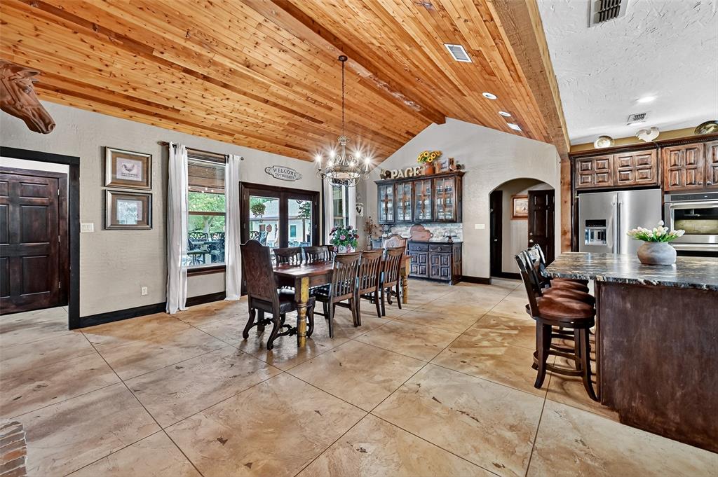 1717 Batey Road Collinsville, TX 76233 - Photo 2 of 40 a view of a dining room with furniture and chandelier