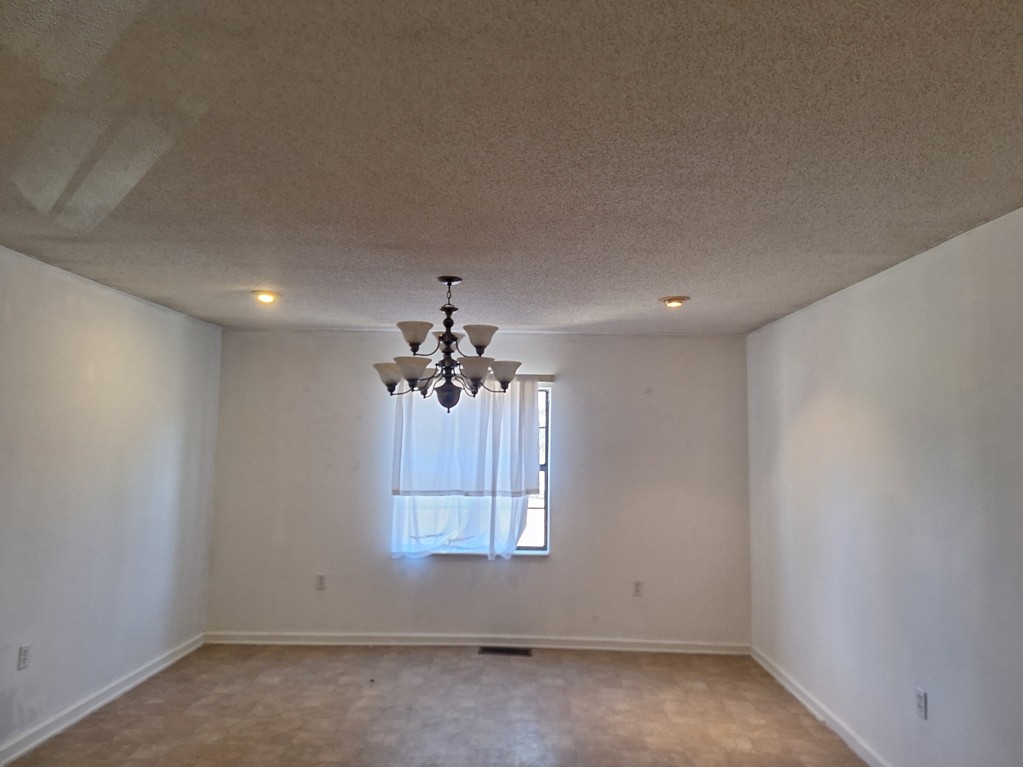 538 Mt Nebo Road Iron City, TN 38463 - Photo 13 of 33 en empty room with chandelier fan