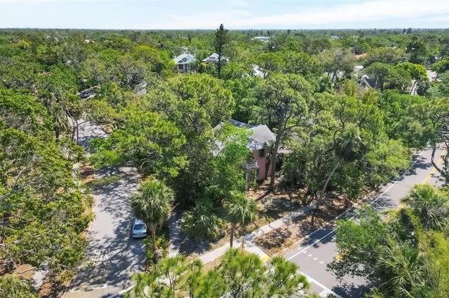 a view of dirt yard with a trees