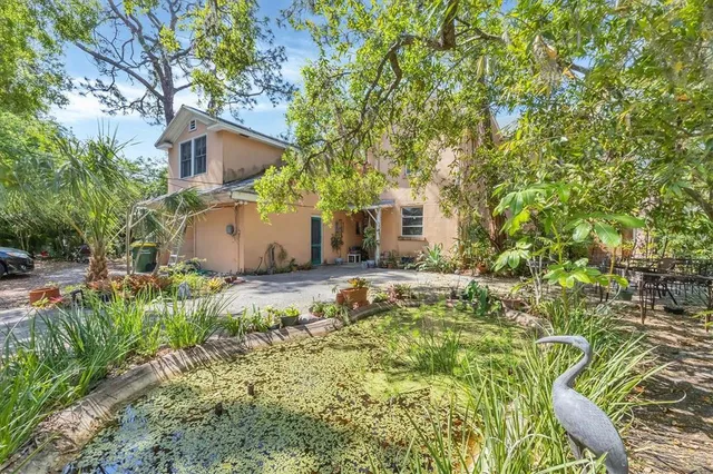 a backyard of a house with lots of green space