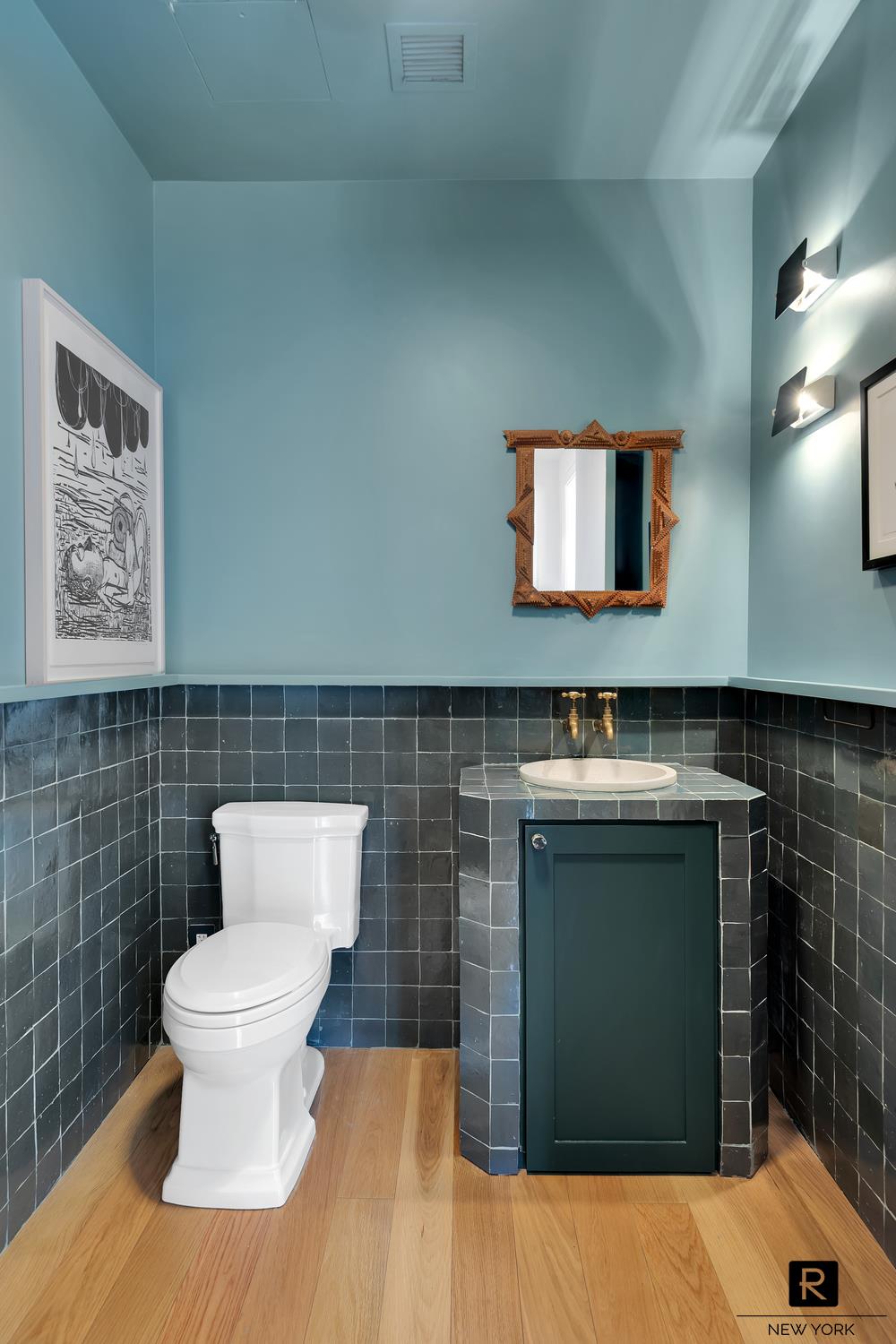 30 Sullivan Street Manhattan, NY 10012 - Photo 10 of 25 a bathroom with a toilet a sink and mirror