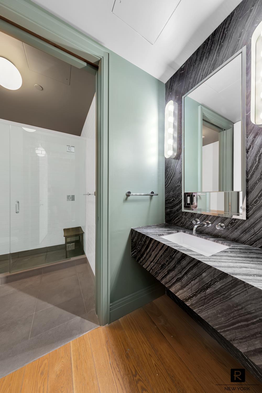 30 Sullivan Street Manhattan, NY 10012 - Photo 18 of 25 a view of a room with wooden floor