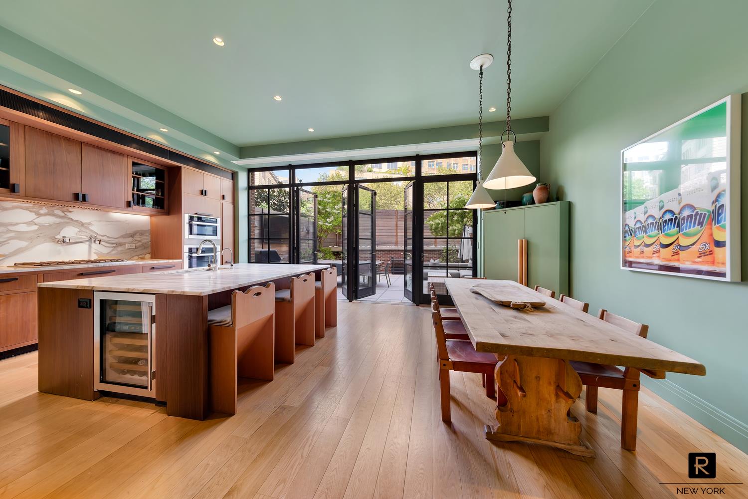 30 Sullivan Street Manhattan, NY 10012 - Photo 5 of 25 a open kitchen with stainless steel appliances granite countertop a stove and a wooden floors
