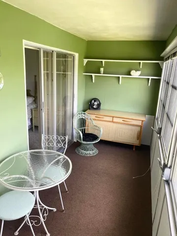a kitchen with a table and chairs