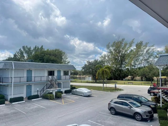 a white house with a big yard