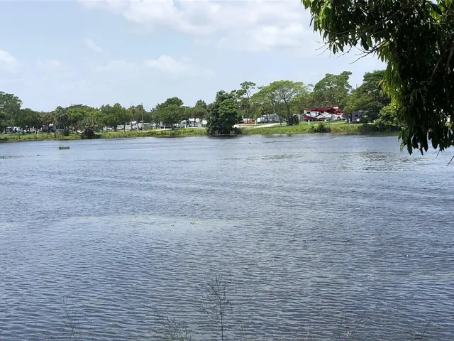 a view of a house with backyard sitting area and garden