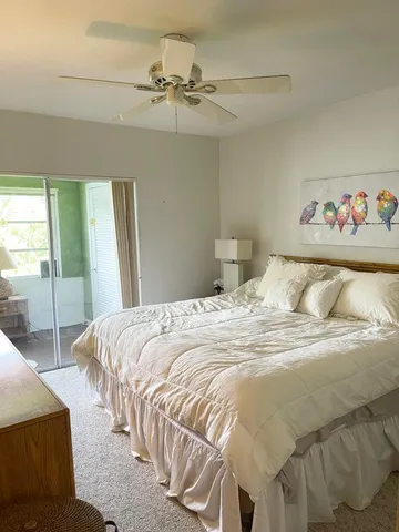 a bedroom with a bed and a table