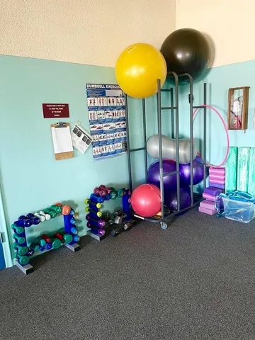 a view of a patio with a table and chairs