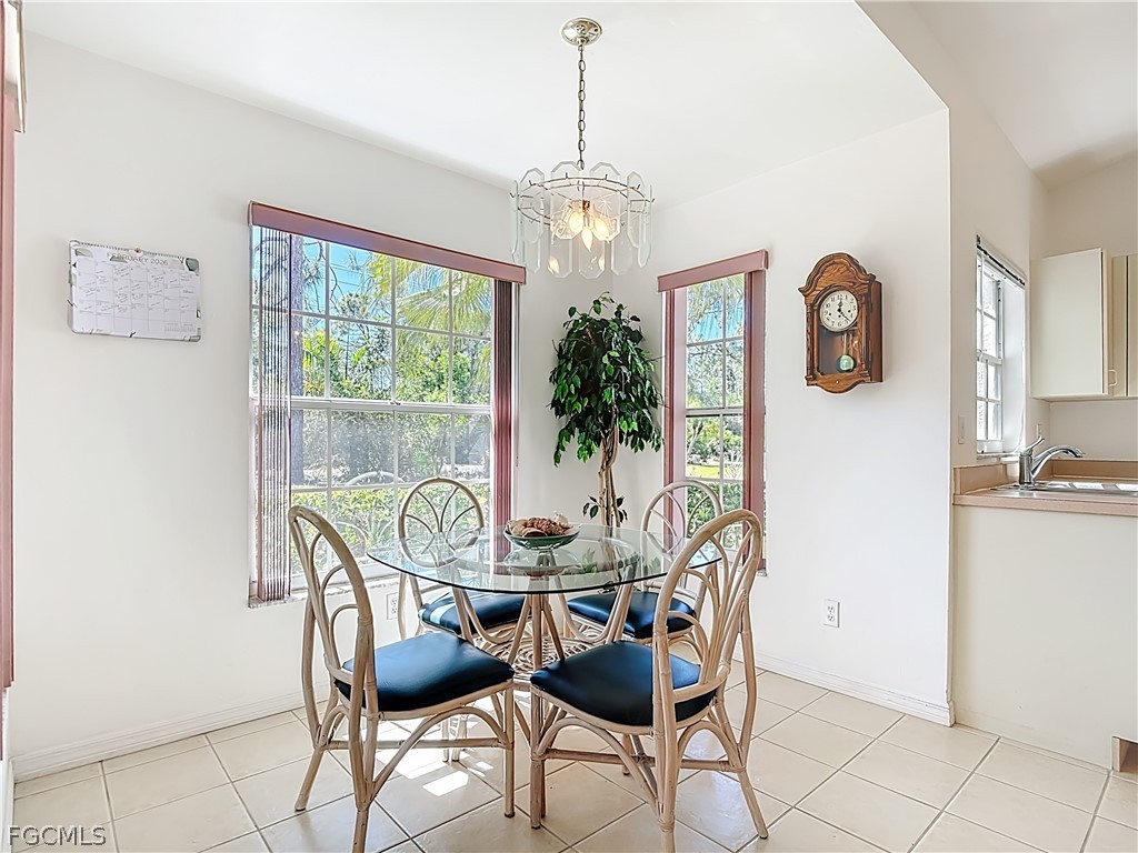 2160 Faliron Road North Fort Myers, FL 33917 - Photo 12 of 42 a dining room with furniture and window