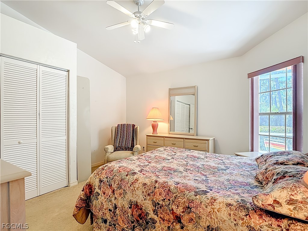 2160 Faliron Road North Fort Myers, FL 33917 - Photo 17 of 42 a bedroom with a large bed and a window