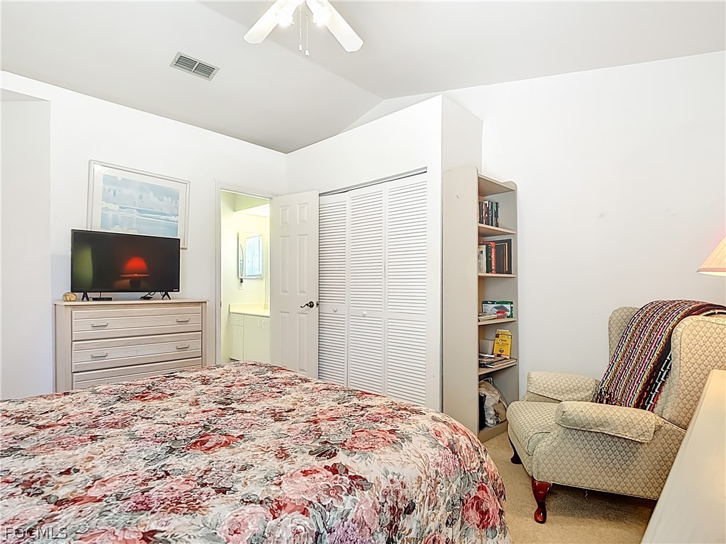 2160 Faliron Road North Fort Myers, FL 33917 - Photo 18 of 42 a bedroom with a bed and flat screen tv