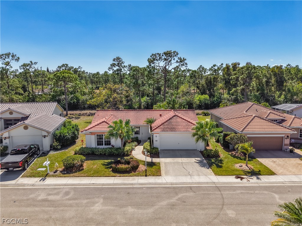 2160 Faliron Road North Fort Myers, FL 33917 - Photo 5 of 42 an aerial view of a house with a garden and mountain view in back