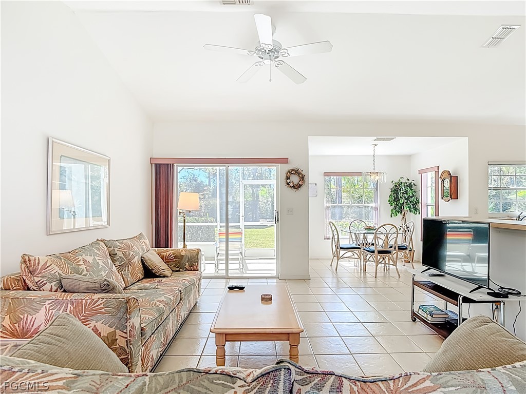 2160 Faliron Road North Fort Myers, FL 33917 - Photo 7 of 42 a living room with furniture and a flat screen tv