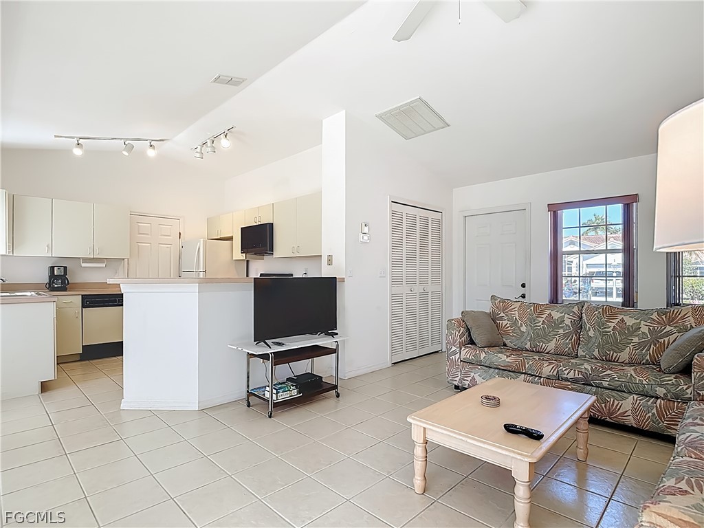 2160 Faliron Road North Fort Myers, FL 33917 - Photo 10 of 42 a living room with furniture and a flat screen tv