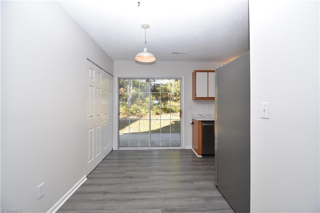 2553 Stratford Lake Road Winston-Salem, NC 27103 - Photo 6 of 19 The dinning area is perfect for meal time. the laundry area is just to the left of the sliding glass door.