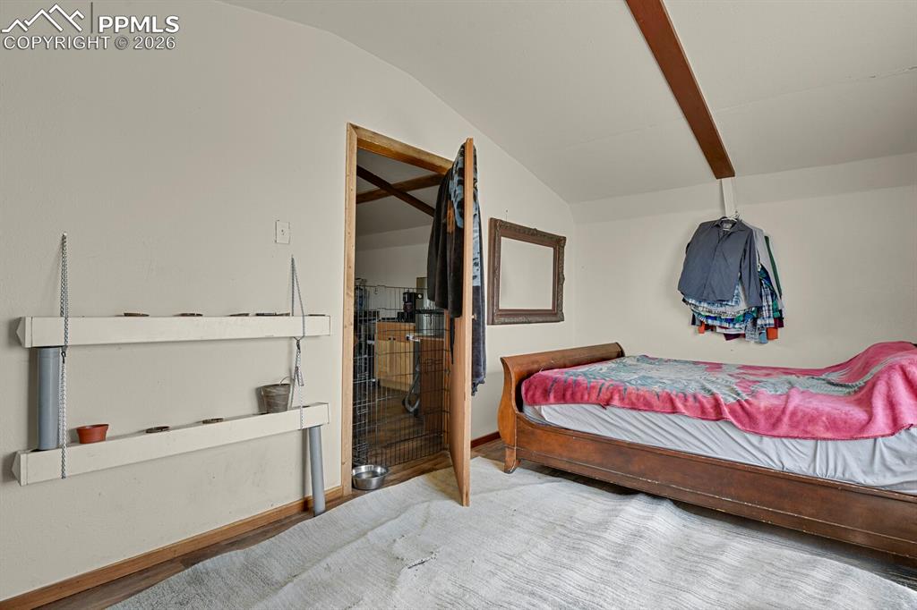 30203 Sanborn Road Yoder, CO 80864 - Photo 11 of 38 a bedroom with a bed and a window
