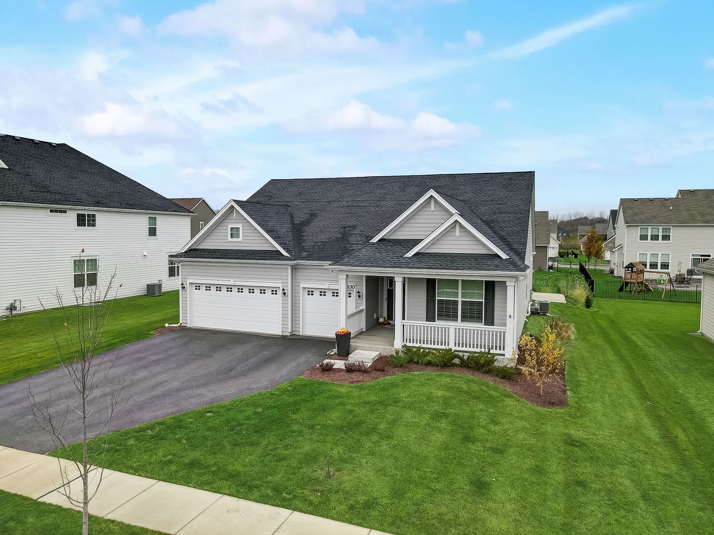 3630 Edelweiss Road Elgin, IL 60124 - Photo 44 of 47 a front view of a house with a yard and garage