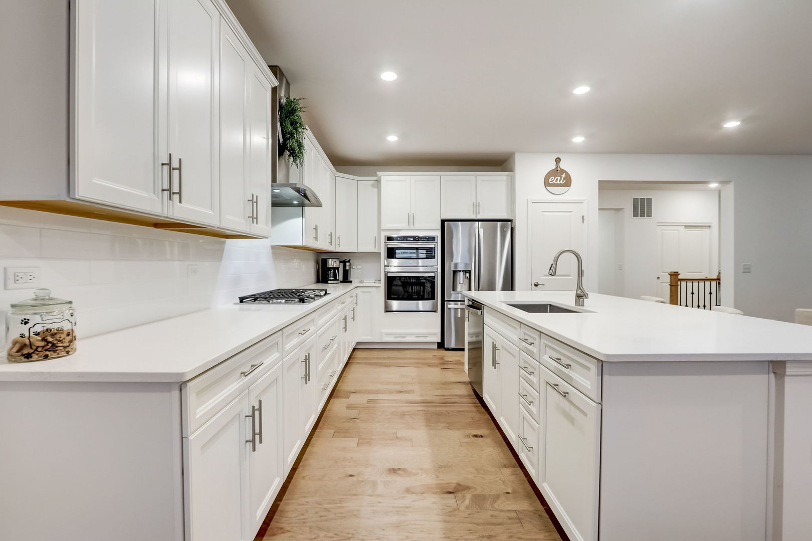 3630 Edelweiss Road Elgin, IL 60124 - Photo 6 of 47 a large kitchen with stainless steel appliances granite countertop a large counter top a stove and a sink