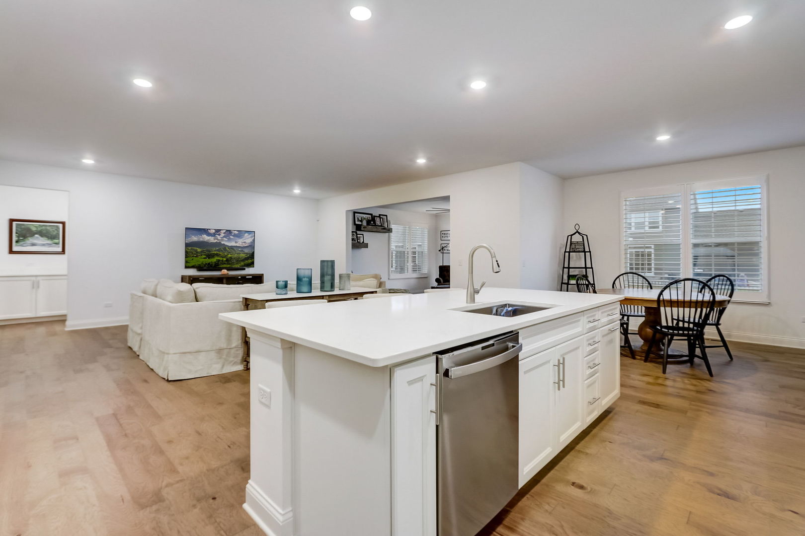 3630 Edelweiss Road Elgin, IL 60124 - Photo 7 of 47 a large kitchen with kitchen island a sink table and chairs