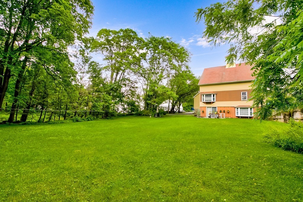 28 Stevens Street, Unit B Methuen, MA 01844 - Photo 11 of 11 a view of a garden with a house