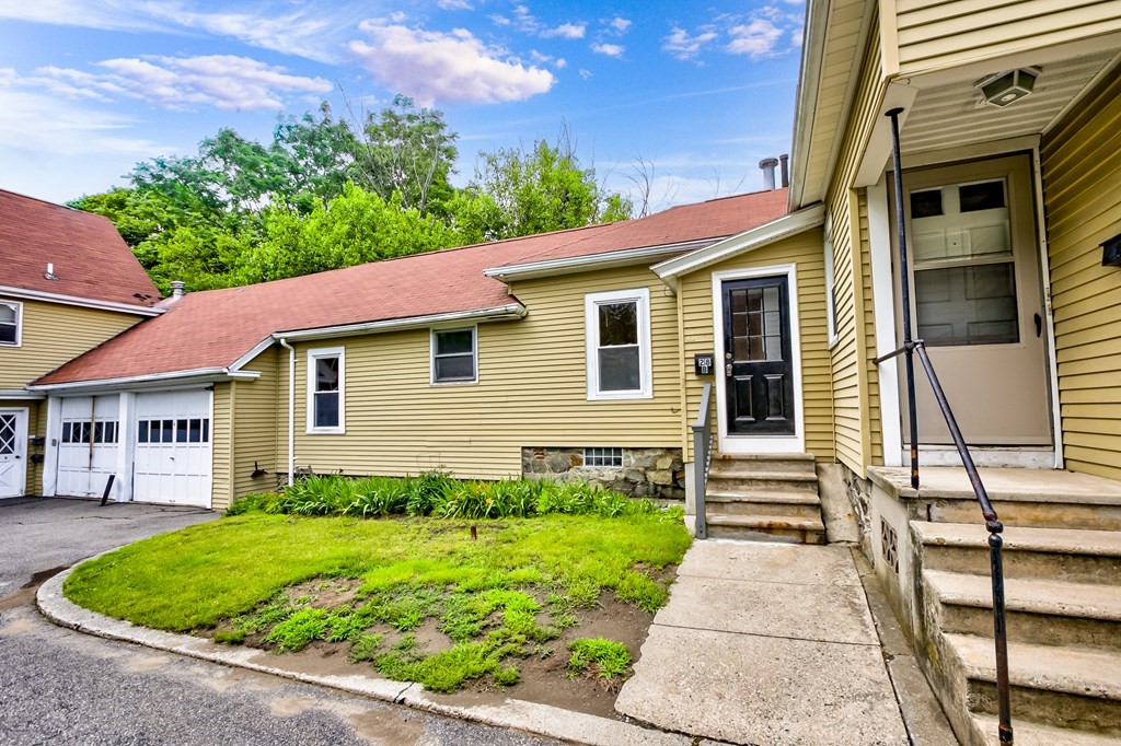 28 Stevens Street, Unit B Methuen, MA 01844 - Photo 2 of 11 a front view of a house with a yard