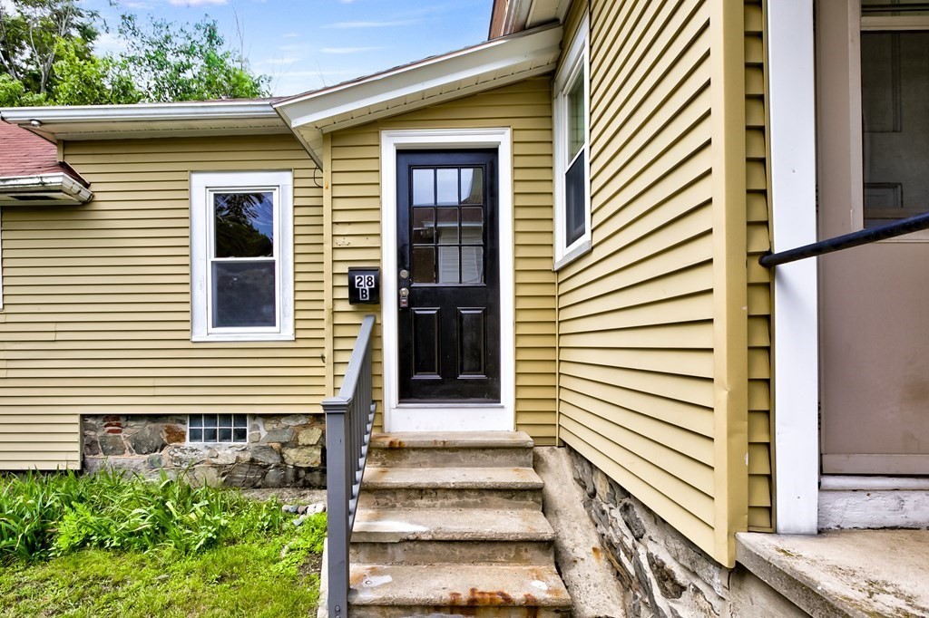 28 Stevens Street, Unit B Methuen, MA 01844 - Photo 3 of 11 a front view of a house with a porch