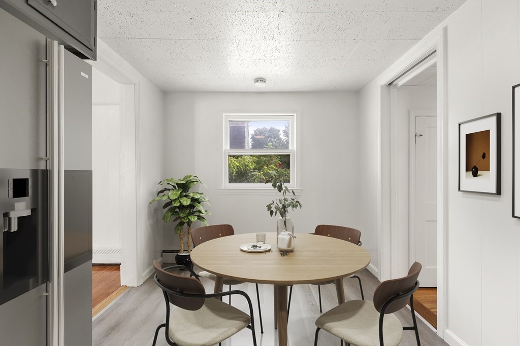 28 Stevens Street, Unit B Methuen, MA 01844 - Photo 6 of 11 a view of a dining room with furniture and window
