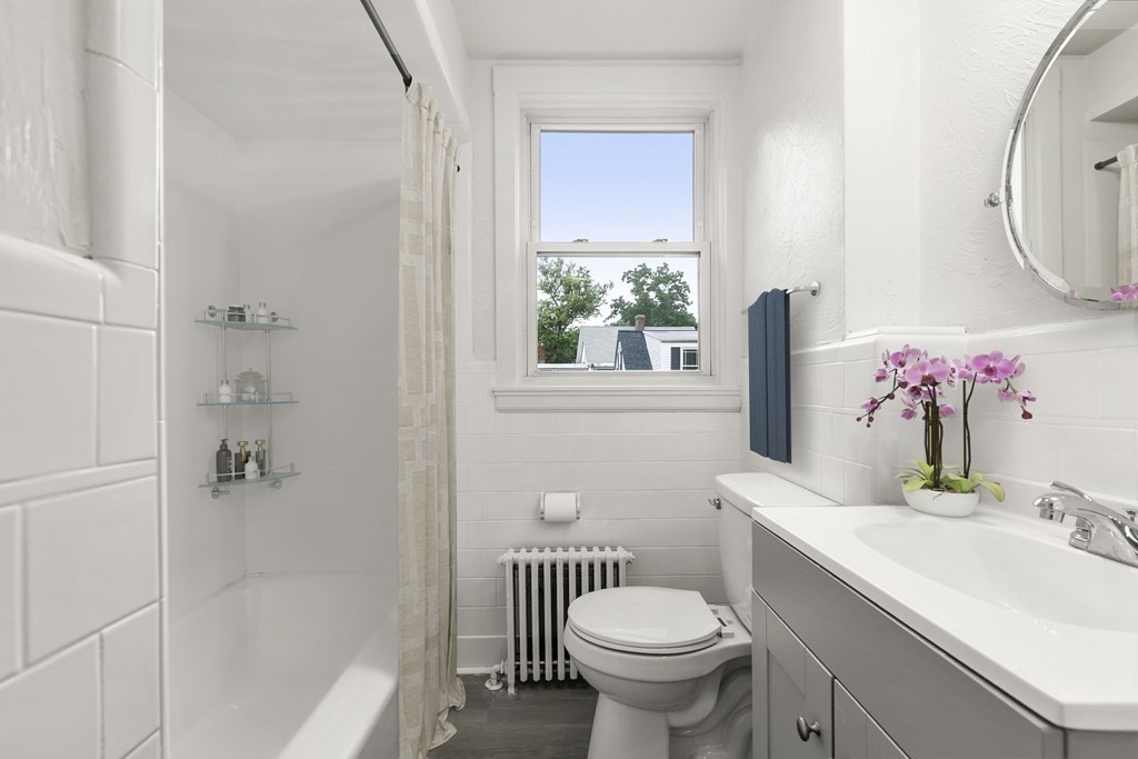28 Stevens Street, Unit B Methuen, MA 01844 - Photo 10 of 11 a bathroom with a sink toilet and shower