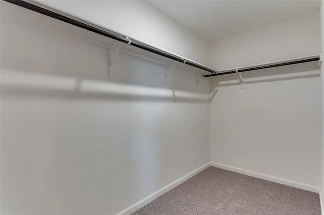 a bathroom with a sink toilet and a mirror