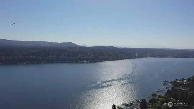 an aerial view of a houses with lake view