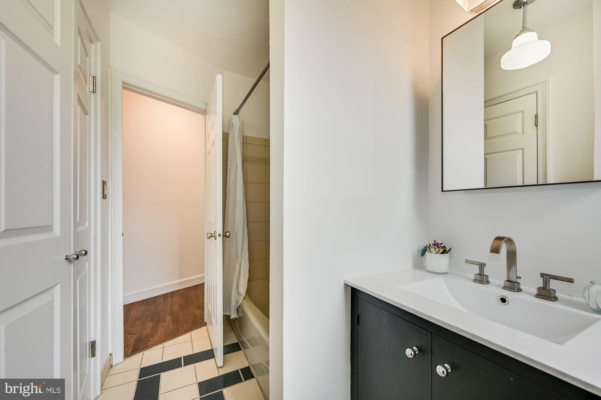 121 13th Street Northeast, Unit 201 Washington, DC 20002 - Photo 9 of 15 Bathroom with large closet, stacked laundry