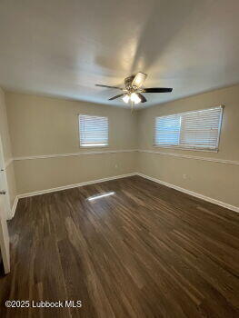 4315 41st Street Lubbock, TX 79413 - Photo 11 of 14 wooden floor in an empty room with a window