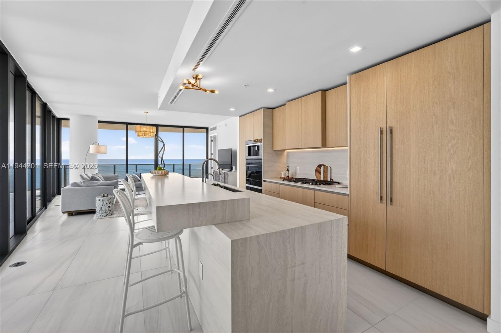 900 North Ocean Boulevard, Unit 906 Pompano Beach, FL 33062 - Photo 12 of 100 Chef-ready galley kitchen with Sub-Zero and Wolf appliances w/ wine cooler, plus integrated espresso/cappuccino system. Italian cabinetry and stone counters