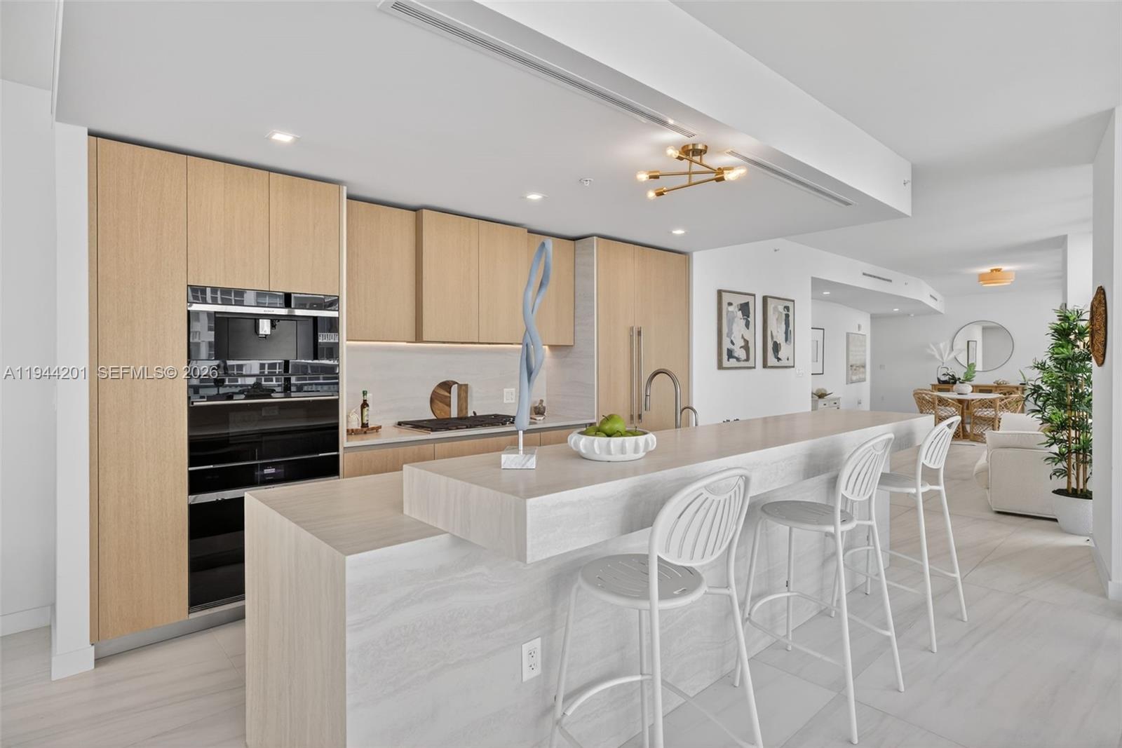900 North Ocean Boulevard, Unit 906 Pompano Beach, FL 33062 - Photo 14 of 100 Chef-ready galley kitchen with Sub-Zero and Wolf appliances w/ wine cooler, plus integrated espresso/cappuccino system. Italian cabinetry and stone counters