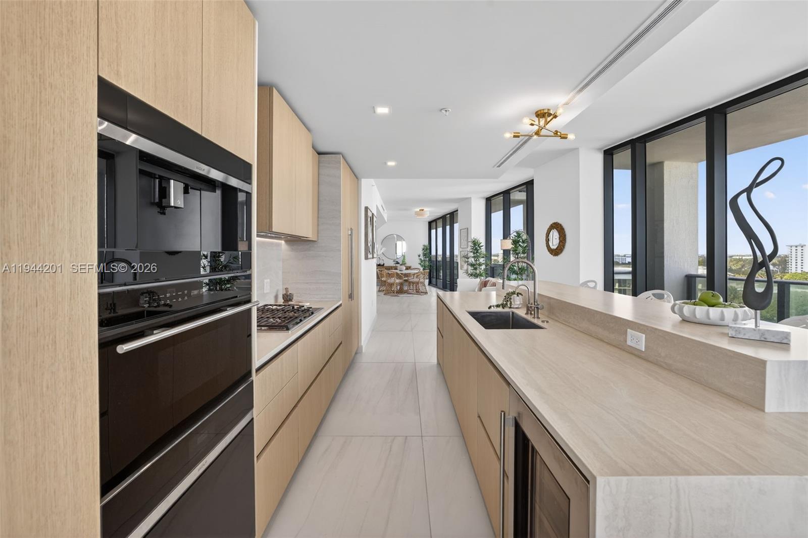 900 North Ocean Boulevard, Unit 906 Pompano Beach, FL 33062 - Photo 15 of 100 Chef-ready galley kitchen with Sub-Zero and Wolf appliances w/ wine cooler, plus integrated espresso/cappuccino system. Italian cabinetry and stone counters