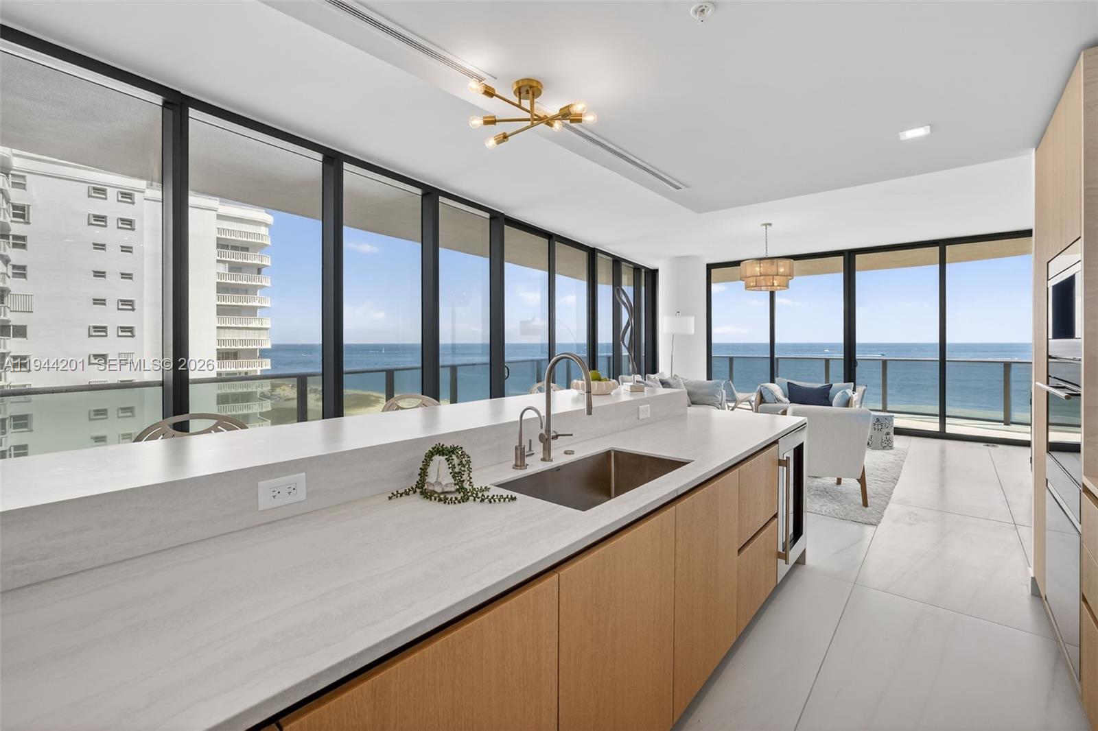 900 North Ocean Boulevard, Unit 906 Pompano Beach, FL 33062 - Photo 19 of 100 Chef-ready galley kitchen with Sub-Zero and Wolf appliances w/ wine cooler, plus integrated espresso/cappuccino system. Italian cabinetry and stone counters. Gas Cooktop