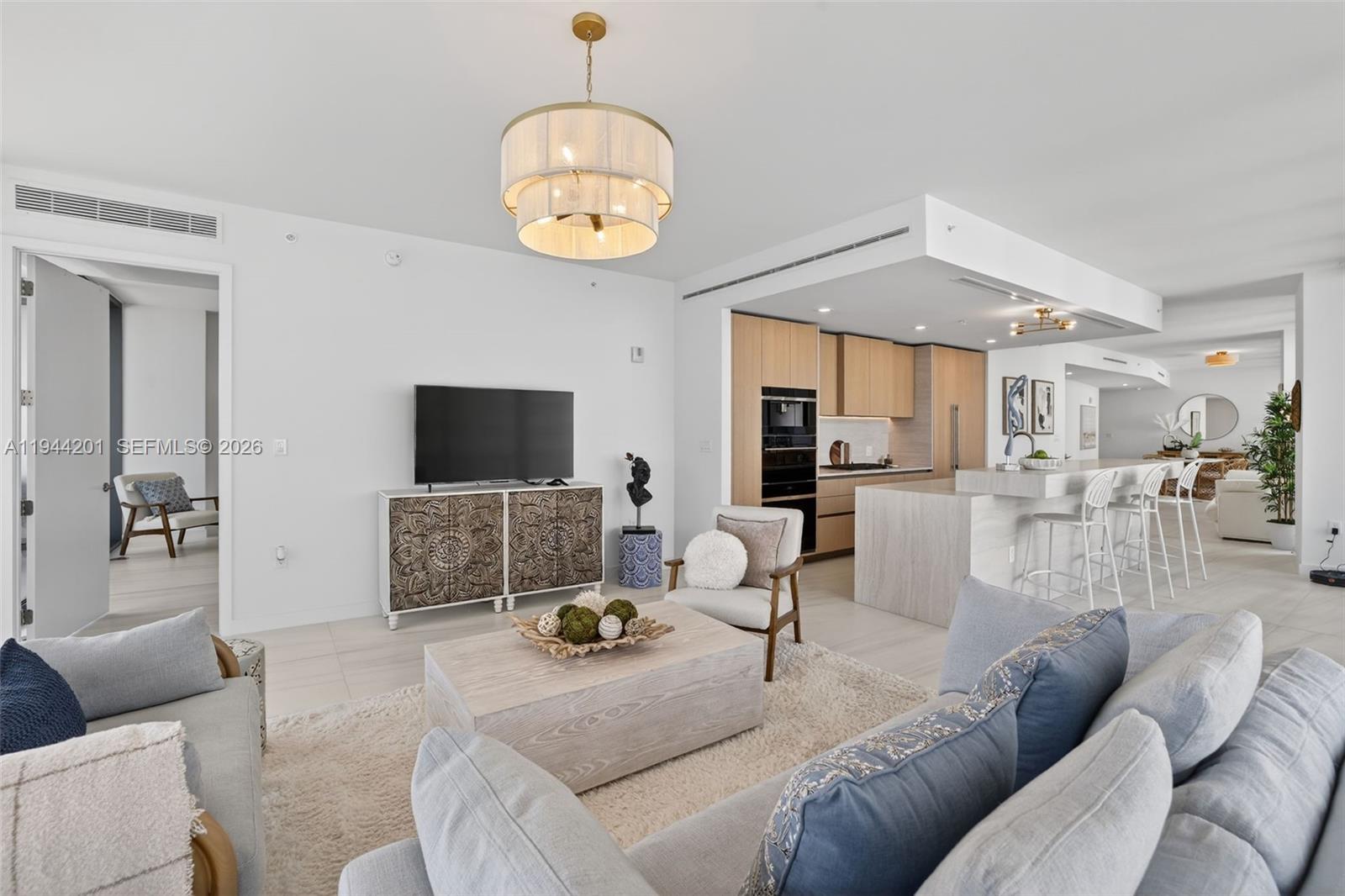 900 North Ocean Boulevard, Unit 906 Pompano Beach, FL 33062 - Photo 21 of 100 Light filled open living area with floor to ceiling glass and seamless indoor outdoor flow to expansive terrace.