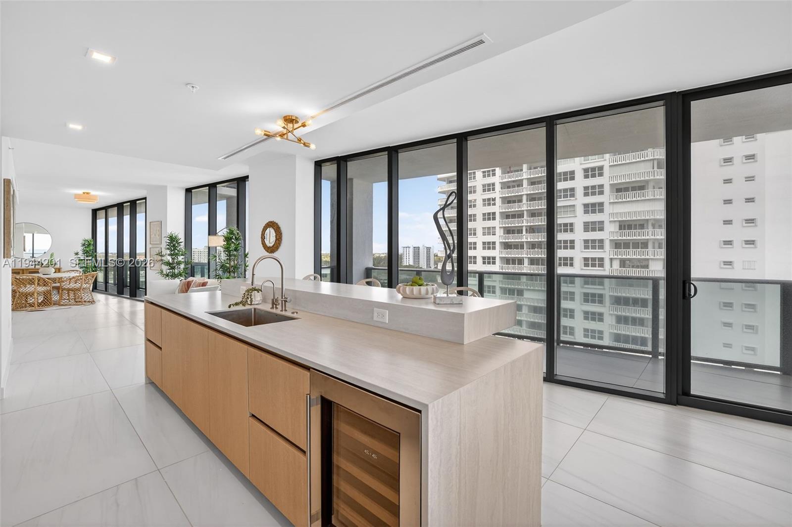 900 North Ocean Boulevard, Unit 906 Pompano Beach, FL 33062 - Photo 21 of 100 Chef-ready galley kitchen with Sub-Zero and Wolf appliances w/ wine cooler, plus integrated espresso/cappuccino system. Italian cabinetry and stone counters. Gas Cooktop