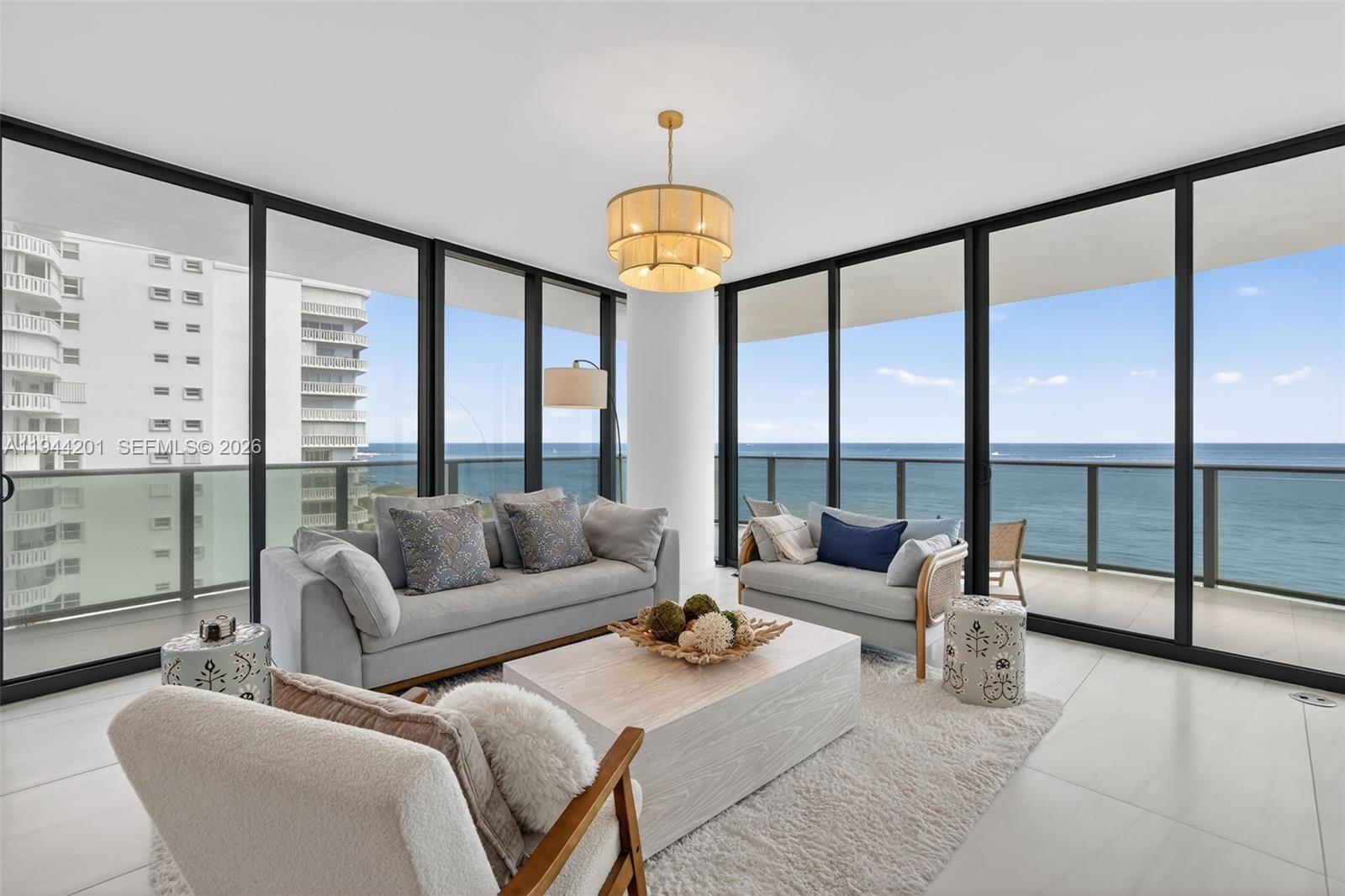900 North Ocean Boulevard, Unit 906 Pompano Beach, FL 33062 - Photo 22 of 100 Light filled open living area with floor to ceiling glass and seamless indoor outdoor flow to expansive terrace.