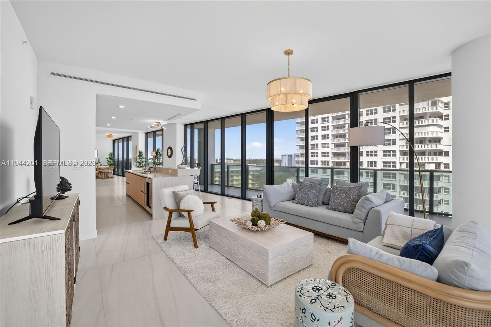 900 North Ocean Boulevard, Unit 906 Pompano Beach, FL 33062 - Photo 23 of 100 Light filled open living area with floor to ceiling glass and seamless indoor outdoor flow to expansive terrace.