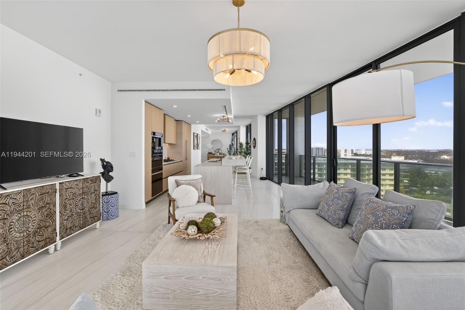 900 North Ocean Boulevard, Unit 906 Pompano Beach, FL 33062 - Photo 25 of 100 Light filled open living area with floor to ceiling glass and seamless indoor outdoor flow to expansive terrace.