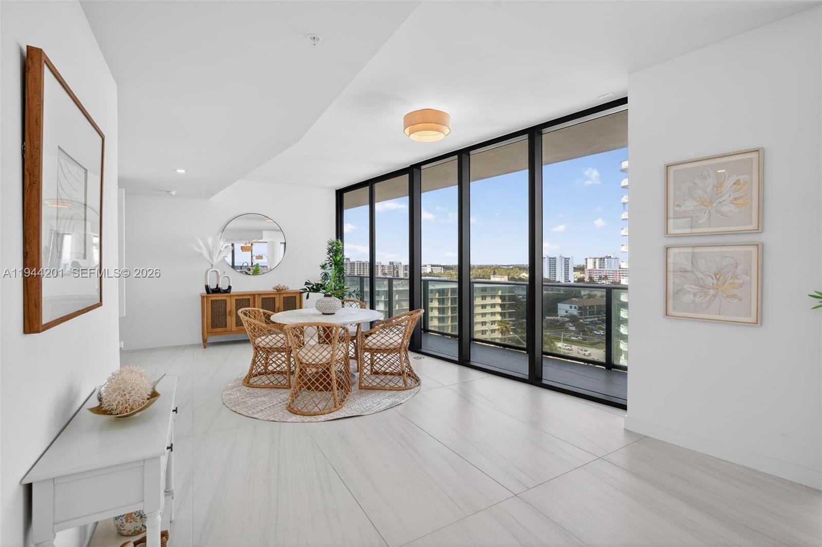 900 North Ocean Boulevard, Unit 906 Pompano Beach, FL 33062 - Photo 28 of 100 Open dining area with floor to ceiling glass, adjacent to chef’s kitchen and terrace for seamless indoor outdoor entertaining. This area is also a possible den / 4th bedroom as per the builders plans. Unit is a 4 bedroom per tax roll